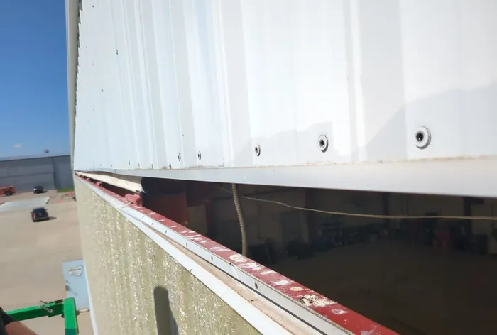 Worn hangar door top seal before replacement