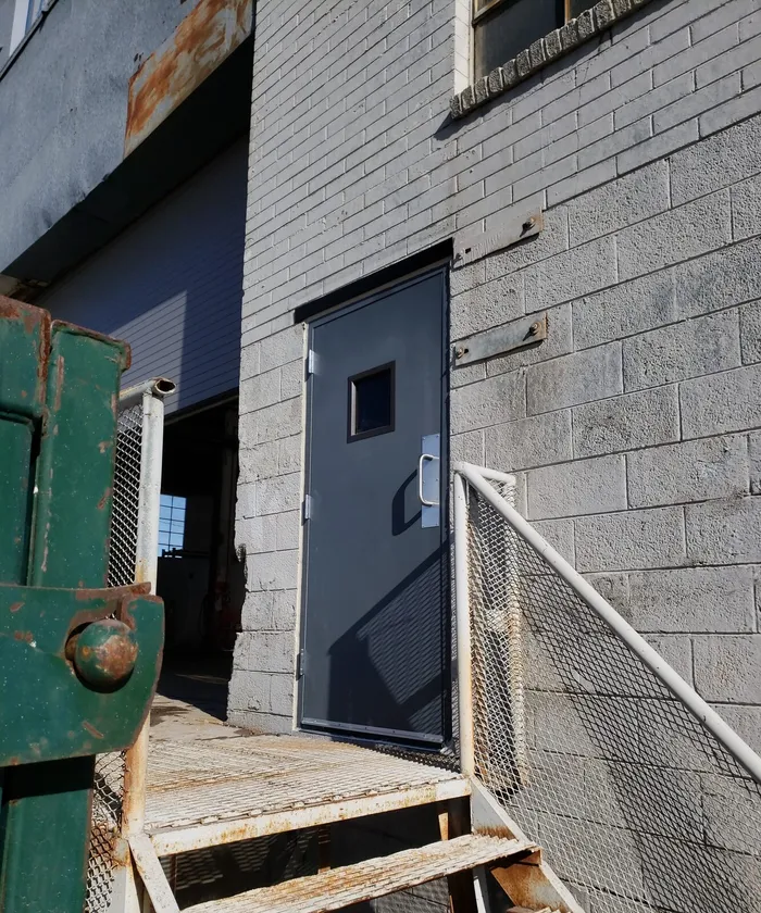 New hollow metal door installed in a masonry wall opening